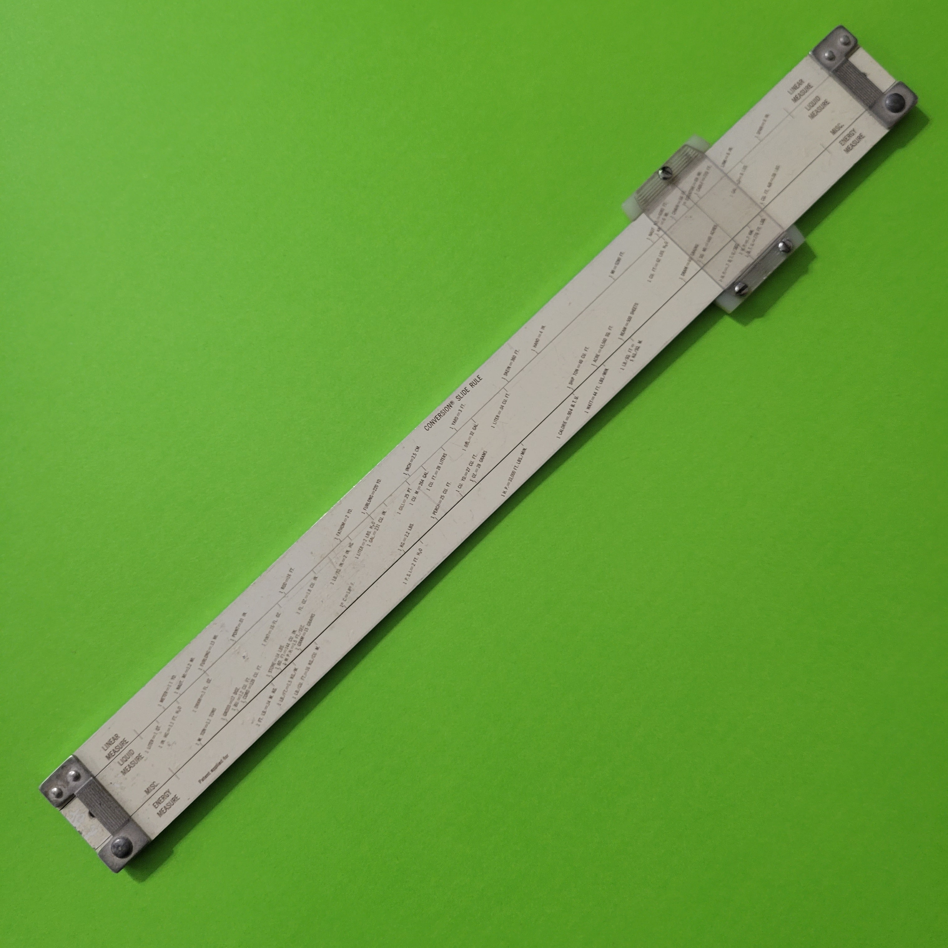 An image of the back conversion scale on the Pickett N-903T Trig and Conversions slide rule